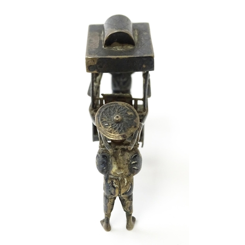 459 - A Chinese export silver model of two figures carrying a sedan chair. Marked with Oriental character ... 