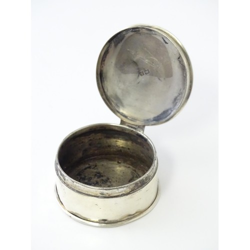 468 - A silver pill box of circular form with engine turned decoration, hallmarked Birmingham 1917, maker ... 