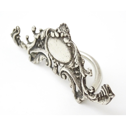 473 - A silver menu / table place card holder with scrolling detail hallmarked Birmingham 1900. Approx. 1 ... 