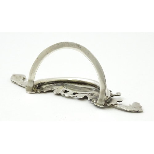 473 - A silver menu / table place card holder with scrolling detail hallmarked Birmingham 1900. Approx. 1 ... 