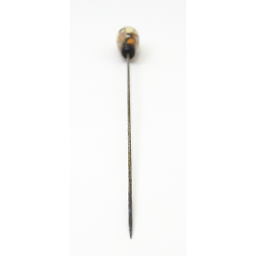 708 - A hat pin surmounted with Japanese Satsuma detail. Approx. 8 1/2