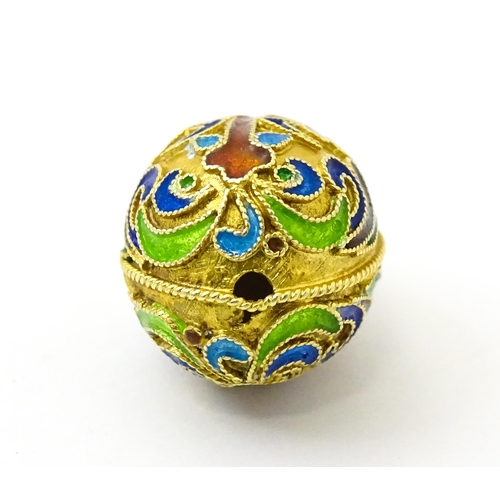 733 - A gilt metal fob / pendant of egg form with champleve enamel cross detail, in the Russian style. App... 