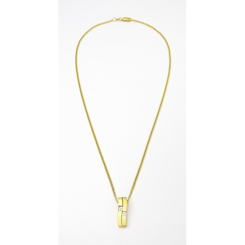 744 - A 9ct gold necklace with 9ct gold pendant set with white stones. The whole approx. 19