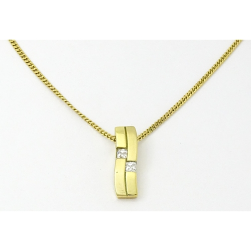 744 - A 9ct gold necklace with 9ct gold pendant set with white stones. The whole approx. 19