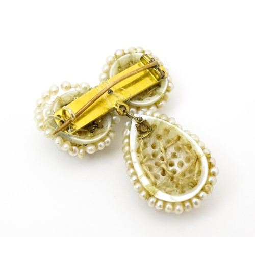 755 - A pair of 19thC mother of pearl and seed pearl earrings. Together with a seed pearl brooch. Earrings... 