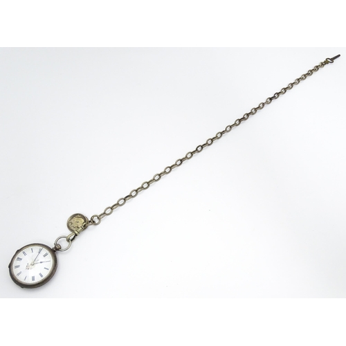 802 - A Victorian silver cased key wind pocket watch, the enamel dial with floral detail, the case hallmar... 