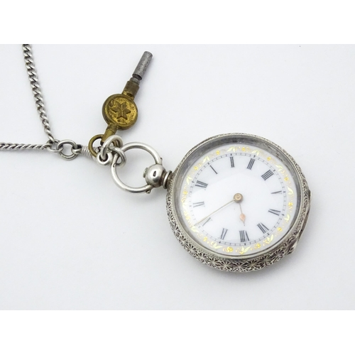 803 - A Swiss .935 silver cased key wind fob watch, the white enamel dial with foliate border, and Roman c... 