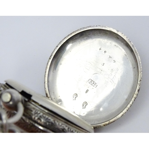 803 - A Swiss .935 silver cased key wind fob watch, the white enamel dial with foliate border, and Roman c... 