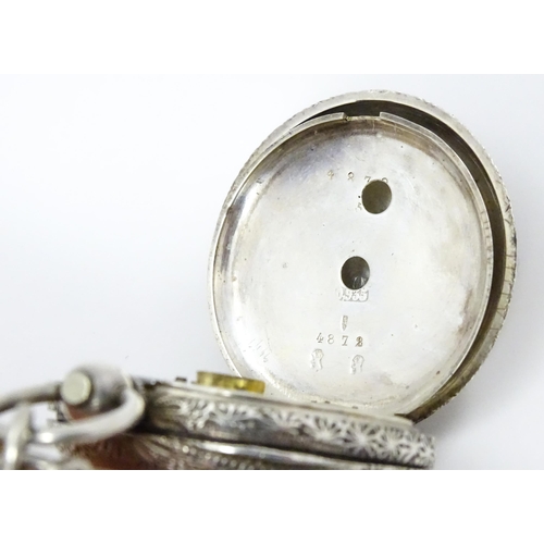 803 - A Swiss .935 silver cased key wind fob watch, the white enamel dial with foliate border, and Roman c... 