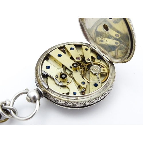 803 - A Swiss .935 silver cased key wind fob watch, the white enamel dial with foliate border, and Roman c... 