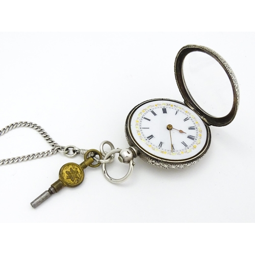 803 - A Swiss .935 silver cased key wind fob watch, the white enamel dial with foliate border, and Roman c... 