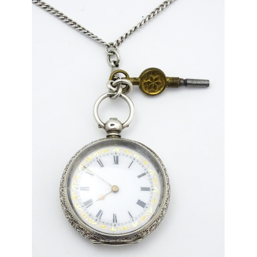 803 - A Swiss .935 silver cased key wind fob watch, the white enamel dial with foliate border, and Roman c... 