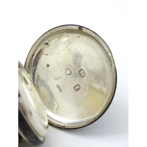 804 - A Swiss .935 silver cased key wind fob watch, the white enamel dial with foliate border, and Roman c... 