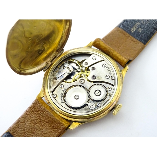 813 - A 9ct gold cased manual wristwatch, the silvered dial with Roman numerals and subsidiary seconds dia... 