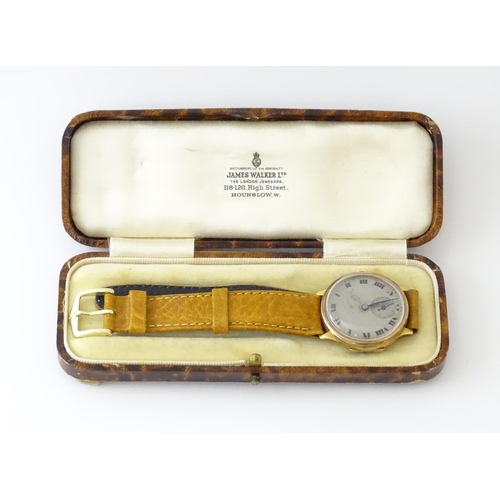 813 - A 9ct gold cased manual wristwatch, the silvered dial with Roman numerals and subsidiary seconds dia... 