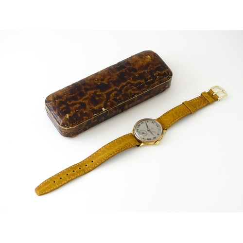 813 - A 9ct gold cased manual wristwatch, the silvered dial with Roman numerals and subsidiary seconds dia... 