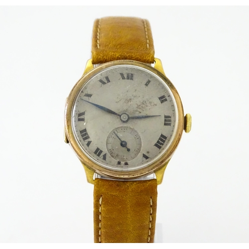 813 - A 9ct gold cased manual wristwatch, the silvered dial with Roman numerals and subsidiary seconds dia... 