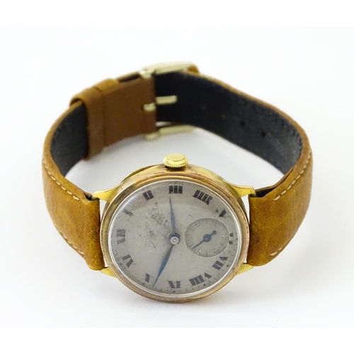 813 - A 9ct gold cased manual wristwatch, the silvered dial with Roman numerals and subsidiary seconds dia... 