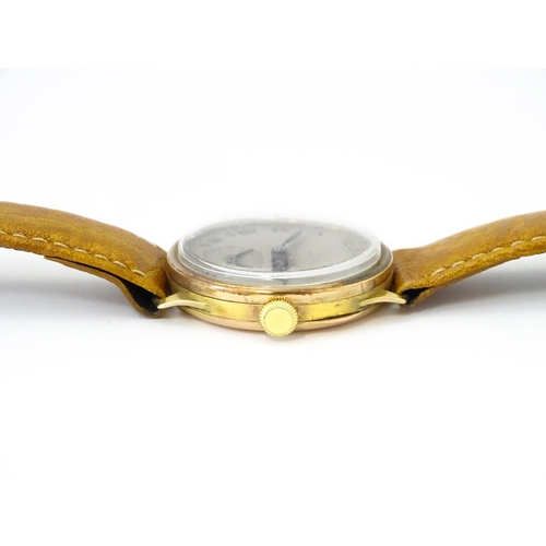 813 - A 9ct gold cased manual wristwatch, the silvered dial with Roman numerals and subsidiary seconds dia... 