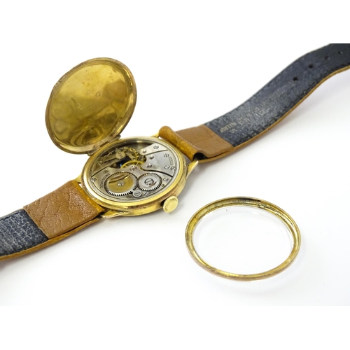 813 - A 9ct gold cased manual wristwatch, the silvered dial with Roman numerals and subsidiary seconds dia... 