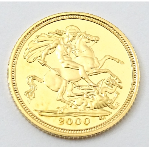 831 - Collectors Coin : a Royal Mint 2000/Millenium gold proof half sovereign, number 0898 of a limited ed... 