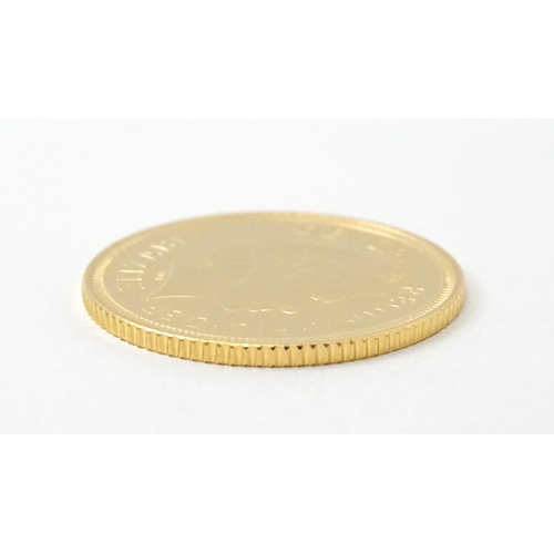 831 - Collectors Coin : a Royal Mint 2000/Millenium gold proof half sovereign, number 0898 of a limited ed... 