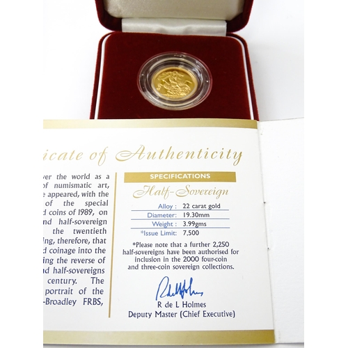 831 - Collectors Coin : a Royal Mint 2000/Millenium gold proof half sovereign, number 0898 of a limited ed... 