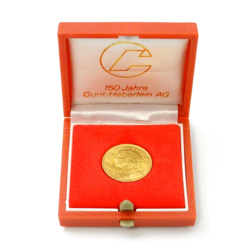 832 - Collector's coin: a boxed 1949 gold Swiss 20 Francs / Vreneli coin, approx 3/4