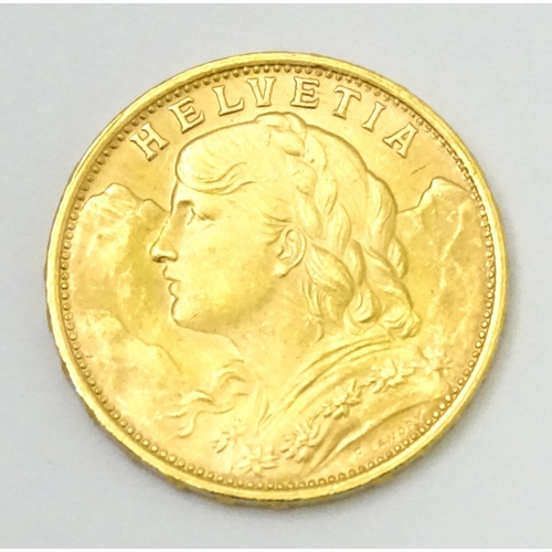 832 - Collector's coin: a boxed 1949 gold Swiss 20 Francs / Vreneli coin, approx 3/4