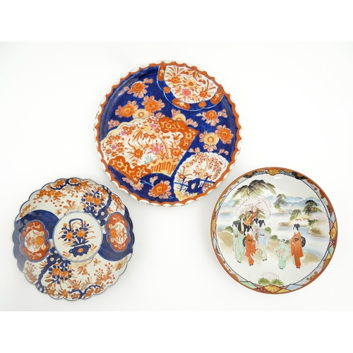 40 - Three various Japanese chargers to include an example decorated in the Imari palette with fan shaped... 