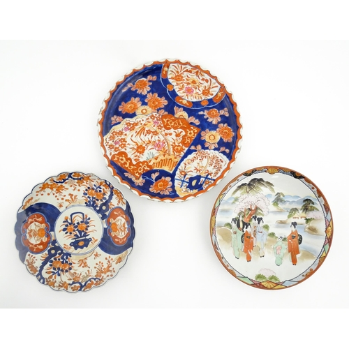 40 - Three various Japanese chargers to include an example decorated in the Imari palette with fan shaped... 