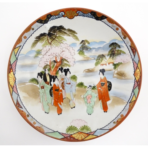 40 - Three various Japanese chargers to include an example decorated in the Imari palette with fan shaped... 