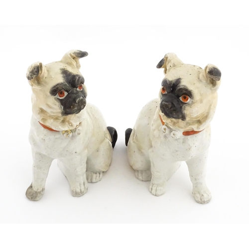 48 - Five assorted pottery models of dogs to include two Staffordshire pottery seated poodles, a seated s... 