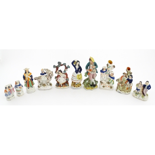 49 - Ten assorted Staffordshire pottery figures to include figural groups, a young girl sat on a goat, bu... 