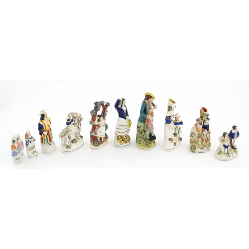 49 - Ten assorted Staffordshire pottery figures to include figural groups, a young girl sat on a goat, bu... 