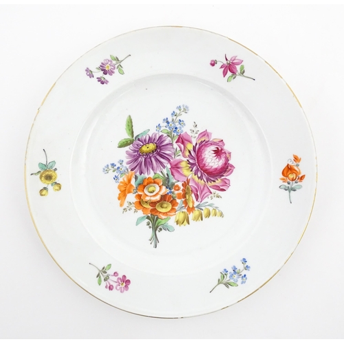 57 - A Meissen cabinet plate with hand painted decoration depicting a central floral spray further border... 