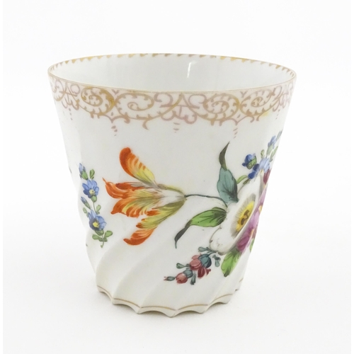 58 - A Dresden Donath & Co. cup and saucer with hand painted decoration depicting flowers and foliage, wi... 