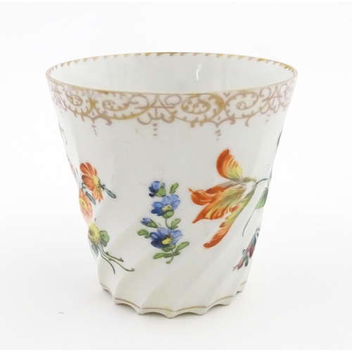 58 - A Dresden Donath & Co. cup and saucer with hand painted decoration depicting flowers and foliage, wi... 