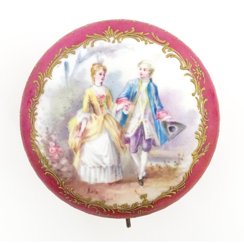 60 - A Sevres porcelain jewellery / trinket box of circular form, the lid decorated with hand painted cou... 