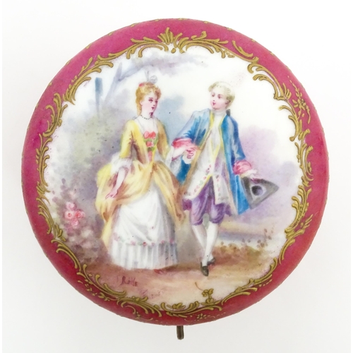 60 - A Sevres porcelain jewellery / trinket box of circular form, the lid decorated with hand painted cou... 