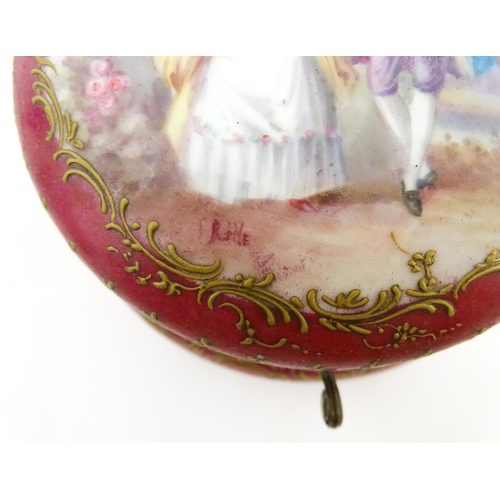 60 - A Sevres porcelain jewellery / trinket box of circular form, the lid decorated with hand painted cou... 