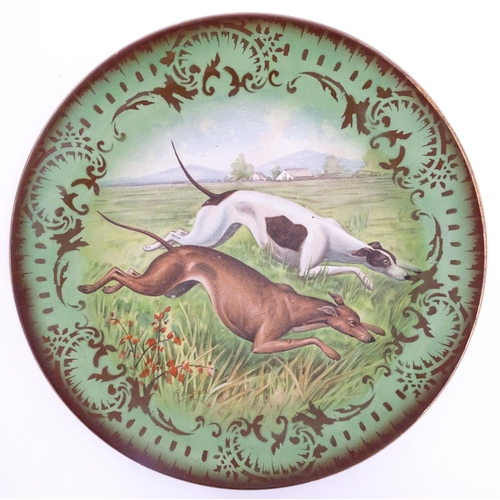 67 - A French St Amand Lebacqz & Bouchard plate decorated with hunting dogs after R. K. Beck. Approx. 11 ... 