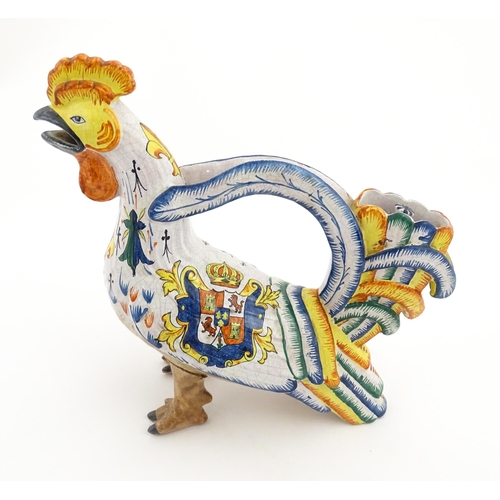 69 - A Continental faience style novelty teapot modelled as a cockerel / rooster decorated with Spanish h... 