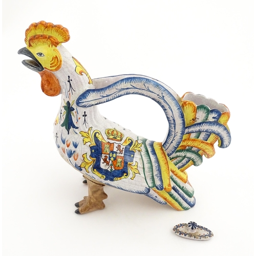 69 - A Continental faience style novelty teapot modelled as a cockerel / rooster decorated with Spanish h... 