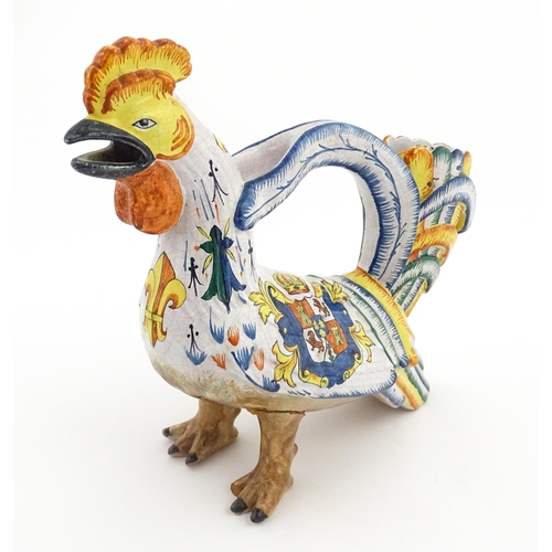 69 - A Continental faience style novelty teapot modelled as a cockerel / rooster decorated with Spanish h... 