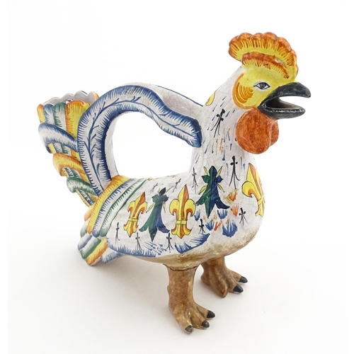 69 - A Continental faience style novelty teapot modelled as a cockerel / rooster decorated with Spanish h... 