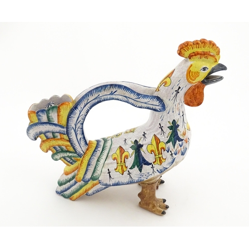 69 - A Continental faience style novelty teapot modelled as a cockerel / rooster decorated with Spanish h... 