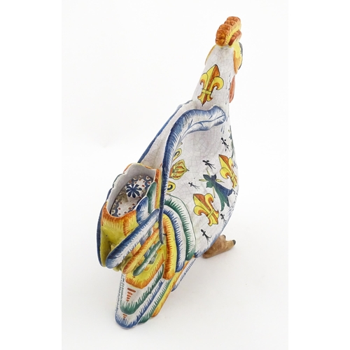 69 - A Continental faience style novelty teapot modelled as a cockerel / rooster decorated with Spanish h... 