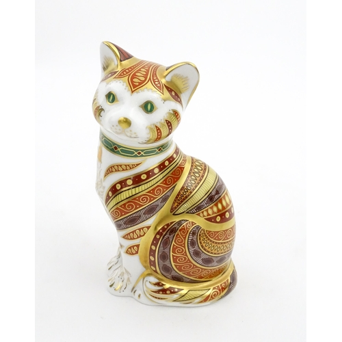 105 - A Royal Crown Derby paperweight modelled as a seated cat, Marmaduke. Marked under, limited edition. ... 