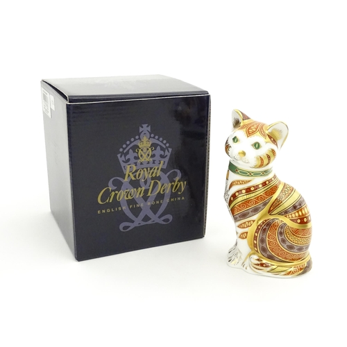 105 - A Royal Crown Derby paperweight modelled as a seated cat, Marmaduke. Marked under, limited edition. ... 